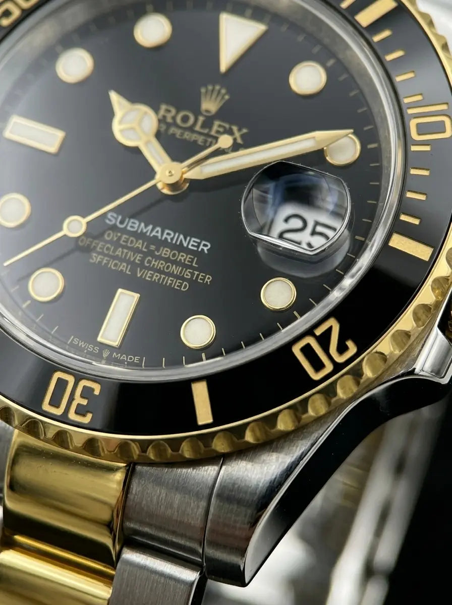Close-up of a Rolex watch with black dial and gold accents.